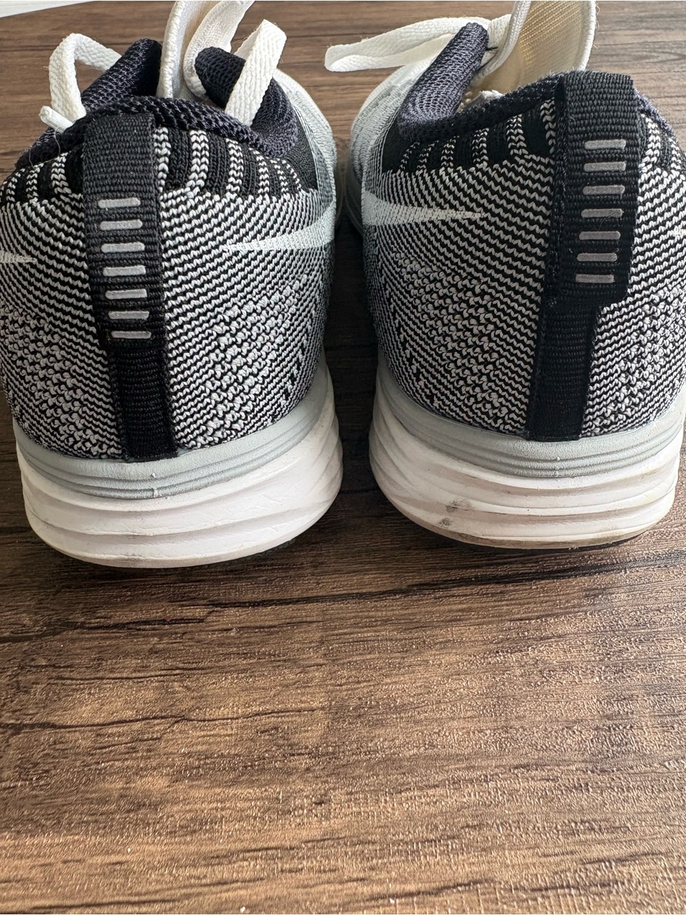 Nike Women’s White and Black Flyknit Sneakers - Picture 5 of 7